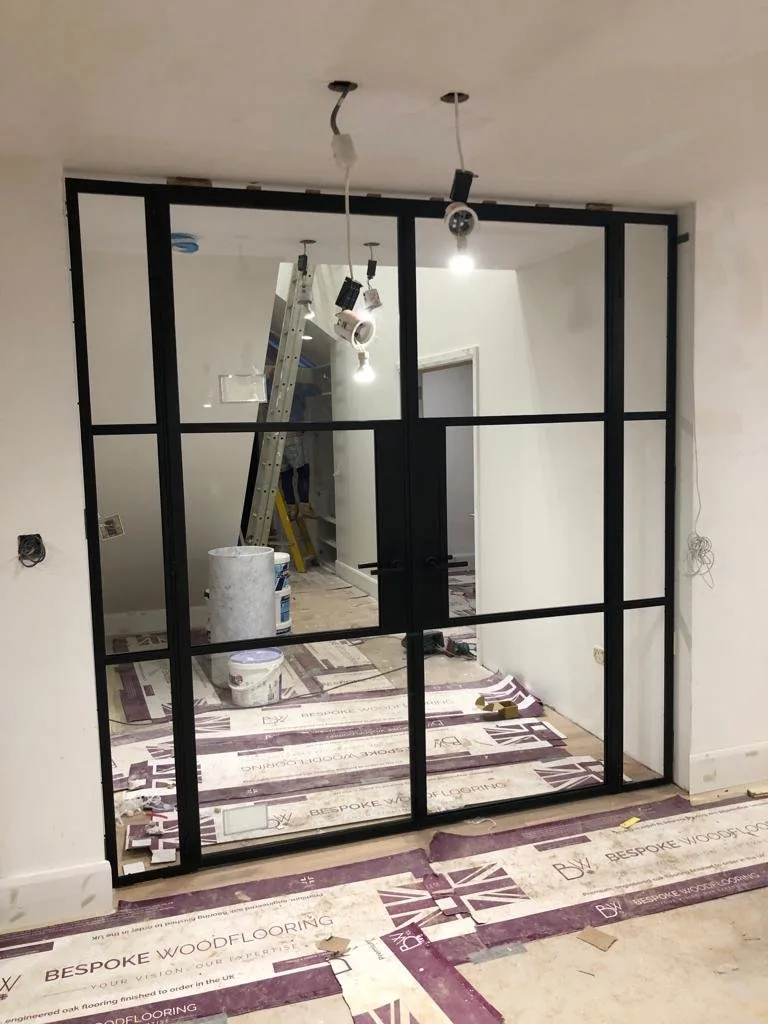 Slim line steel doors with fire-rated glazing