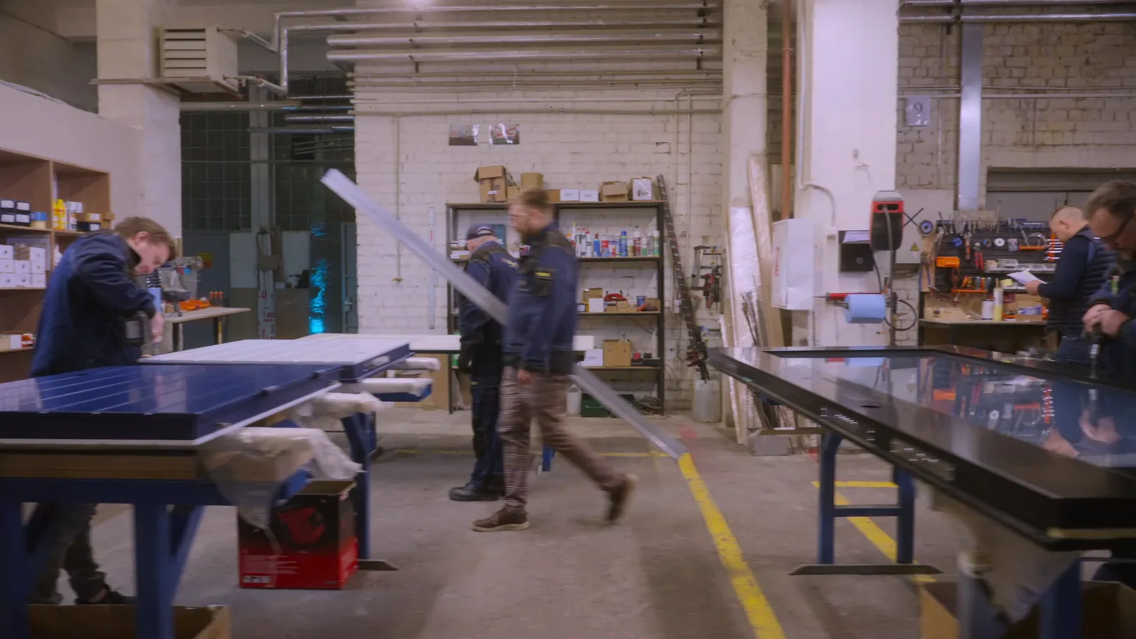 Craftsmen assembling a bespoke security door in the manufacturing facility